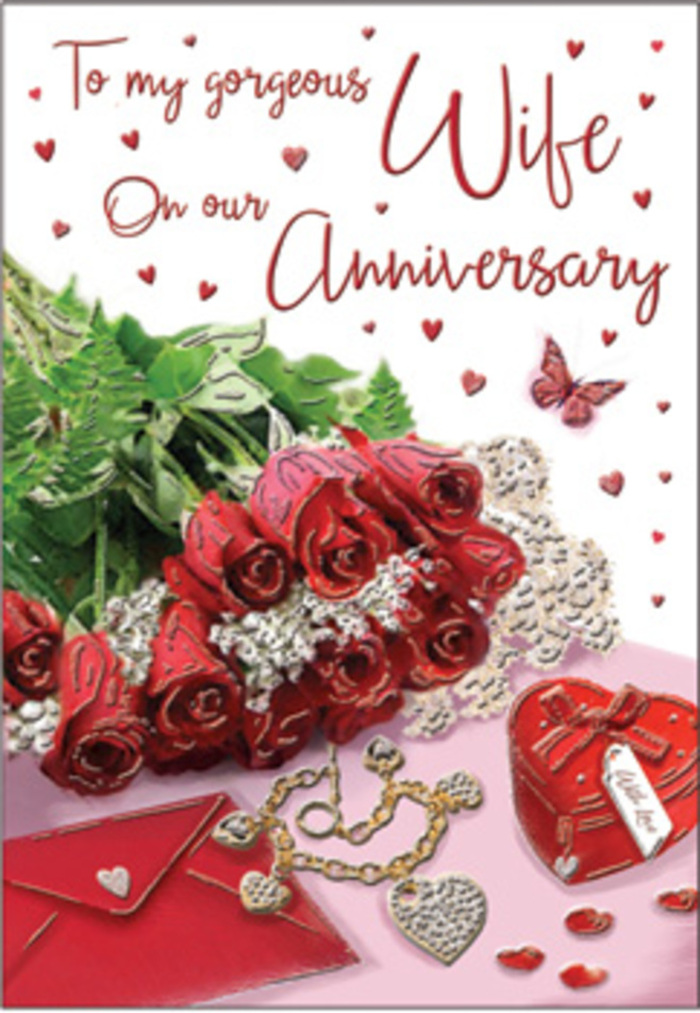 A richly emotive anniversary scene unfolds across this card, where a bouquet of classic red roses stands proudly at the centre, just as it might on a polished table in an Anerley living room on a special evening. Each rose is luxuriously full, petals fanning out in generous, velvety layers that capture the light with subtle sheen. Their bold crimson hue feels both passionate and reassuring, softened and elevated by surrounding lush greenery that peeks between the blooms, giving an impression of natural abundance. The roses appear elegantly gathered, the composition echoing the look of a hand-wrapped bouquet fresh from a skilled florist near Anerley Road. Around this floral heart of the design, delicate and romantic accents are carefully placed: a coordinated jewellery set with golden tones glinting softly, and a vivid red gift box whose smooth, almost satin-like finish suggests an important anniversary present cherished over the years. Whisper-thin lace details and small heart motifs weave through the arrangement, their intricate textures catching the eye like fine ribbon or decorative wrap used for special-occasion flowers. A scripted anniversary message flows across the card, its cursive style graceful and personal, mirroring the kind of sentiment one might share after many shared milestones in Anerley. Soft, glowing light envelops the entire scene, bringing out the richness of velvet-like petals, polished metal, and silky fabrics, and casting gentle shadows that add depth and warmth. The overall atmosphere is undeniably romantic, evoking a feeling of being held in a warm embrace, making this design a memorable visual companion to the heartfelt words and treasured gifts exchanged on such an important anniversary.